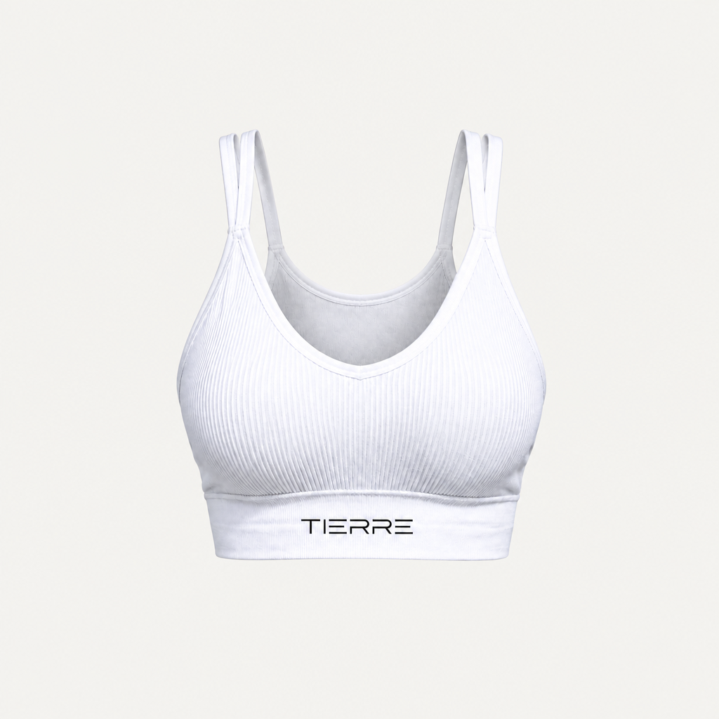Top sportivo bianco TIERRE vista frontale su canvas quadrato con margini ampi